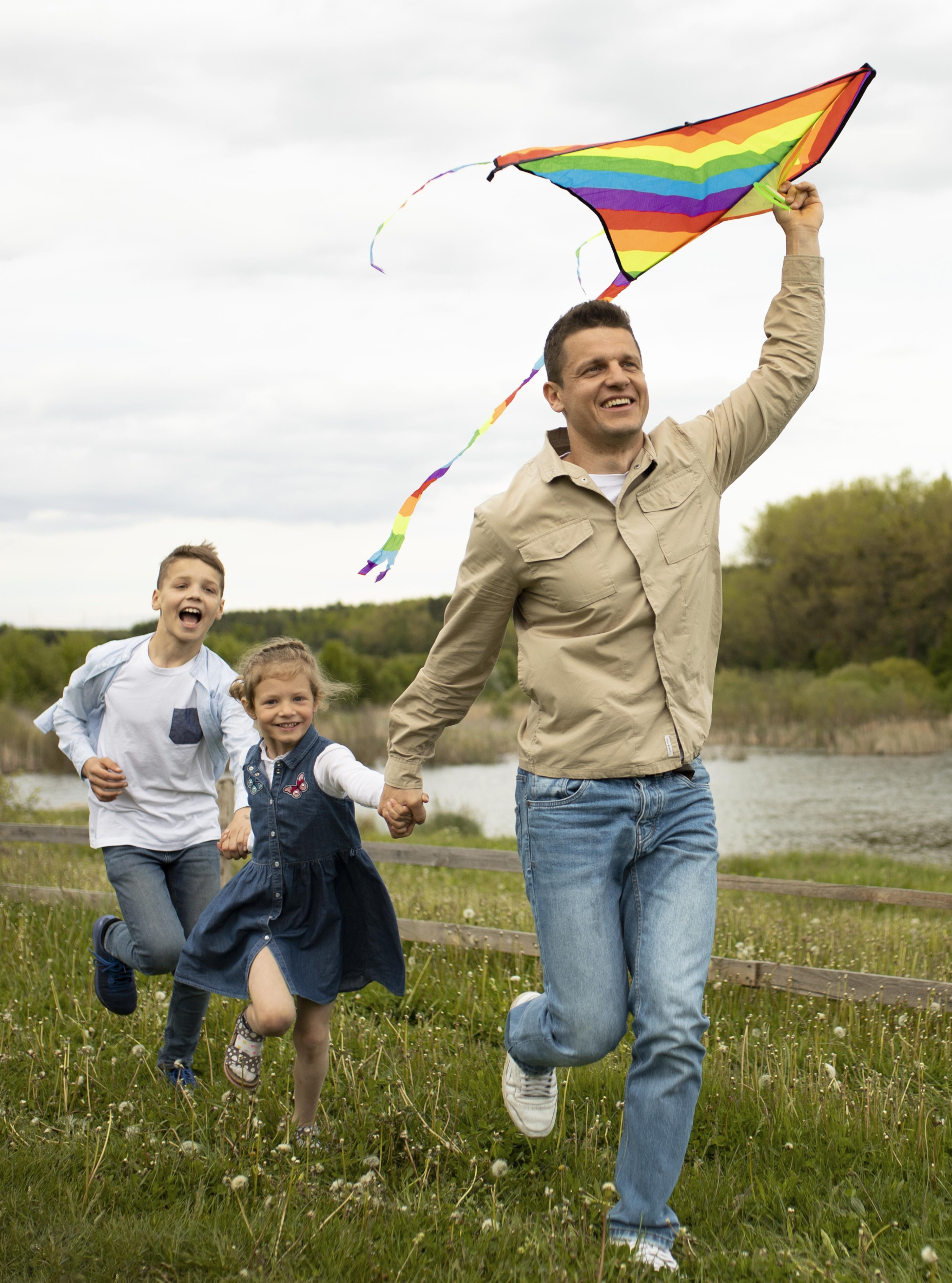 full-shot-family-with-colorful-kite.jpg
