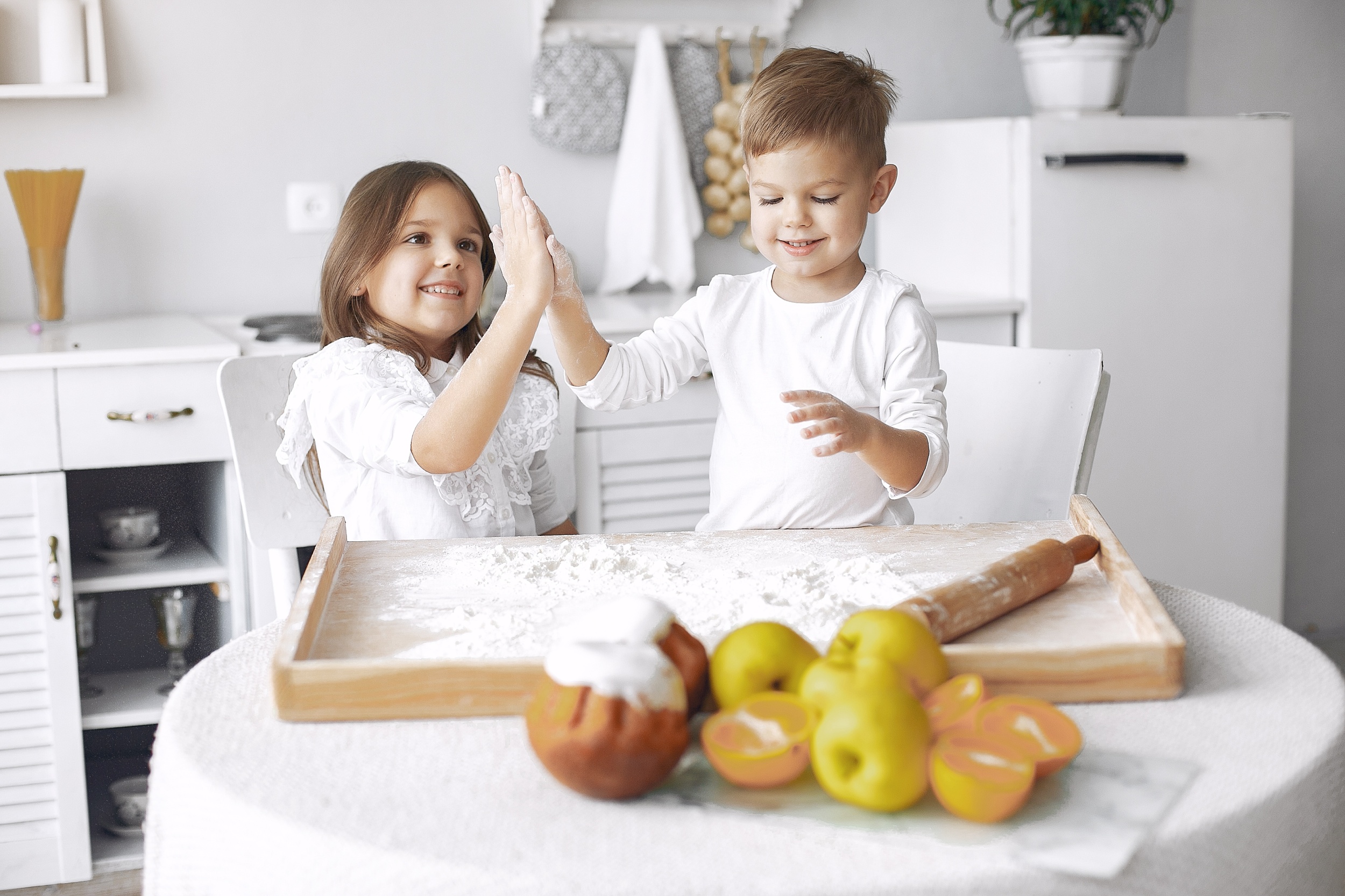 cute-little-children-sitting-kitchen-with-dough.jpg
