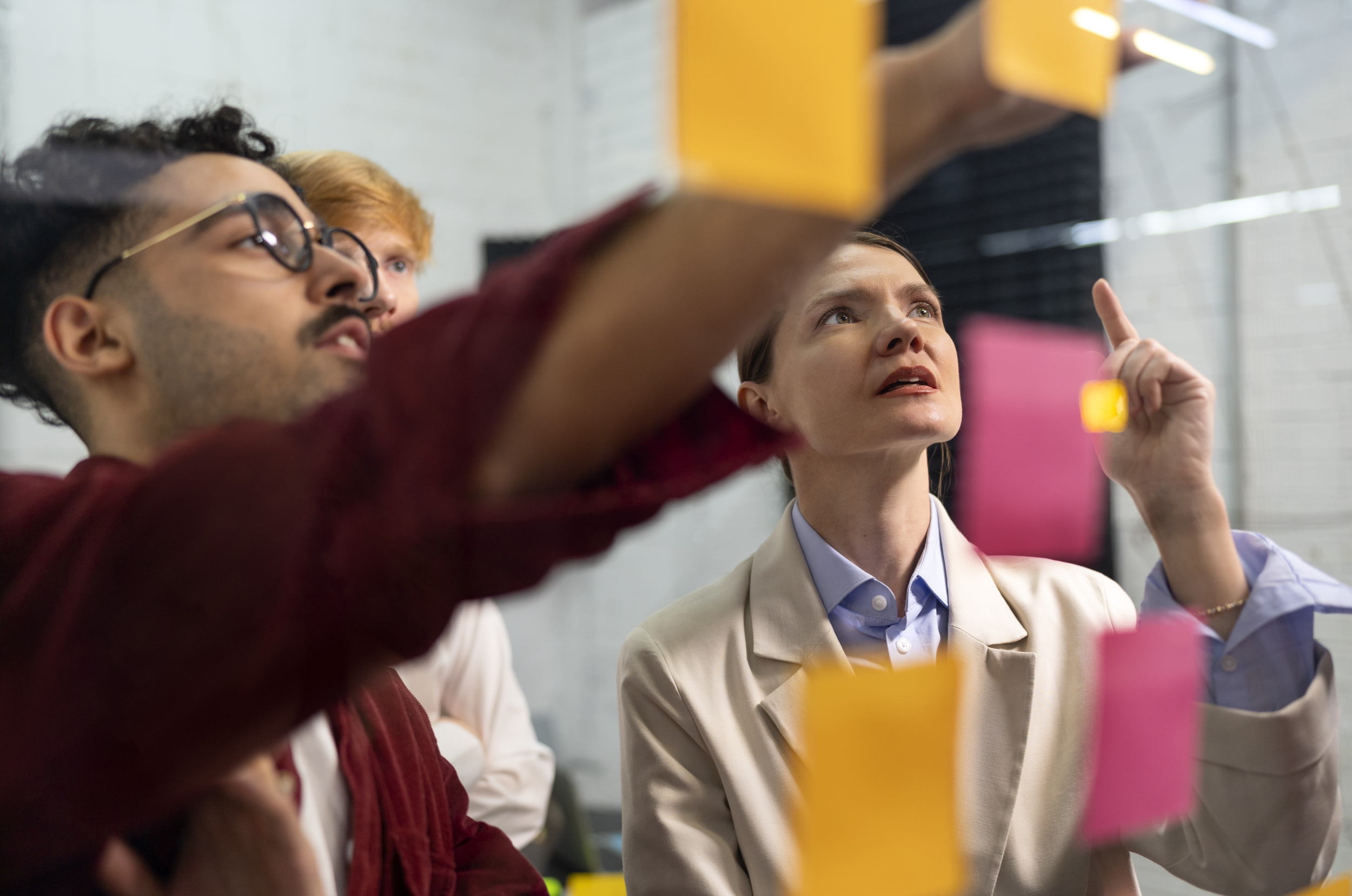 1 colleagues-thinking-with-post-its-side-view.jpg