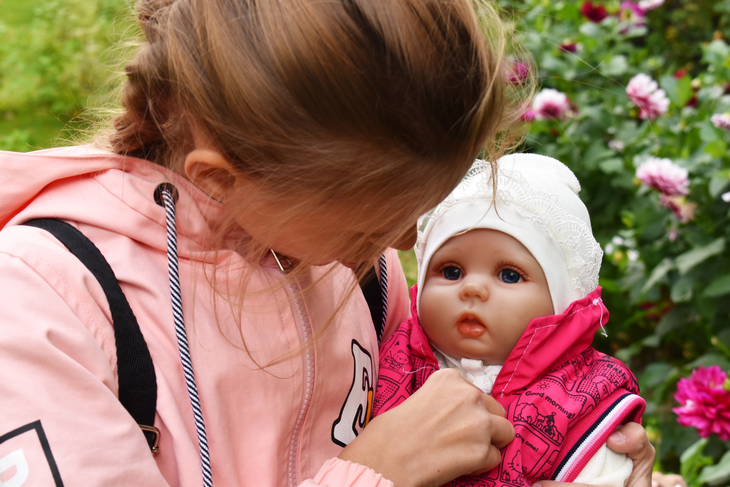 little-girl-holding-baby-doll.jpg