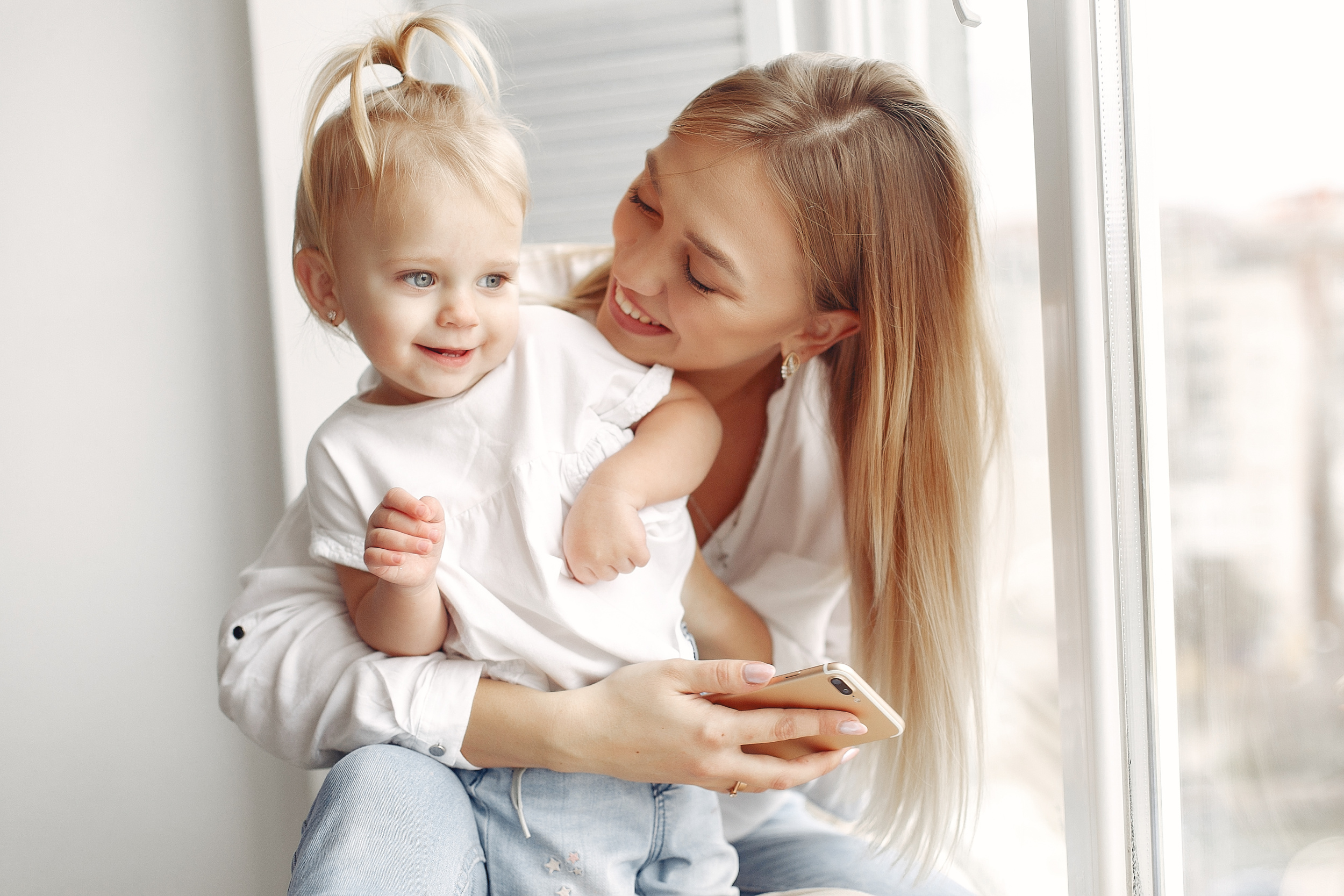 woman-uses-phone-mother-white-shirt-is-playing-with-her-daughter-family-has-fun-weekends.jpg woman-uses-phone-mother-white-shirt-is-playing-with-her-daughter-family-has-fun-weekends.jpg