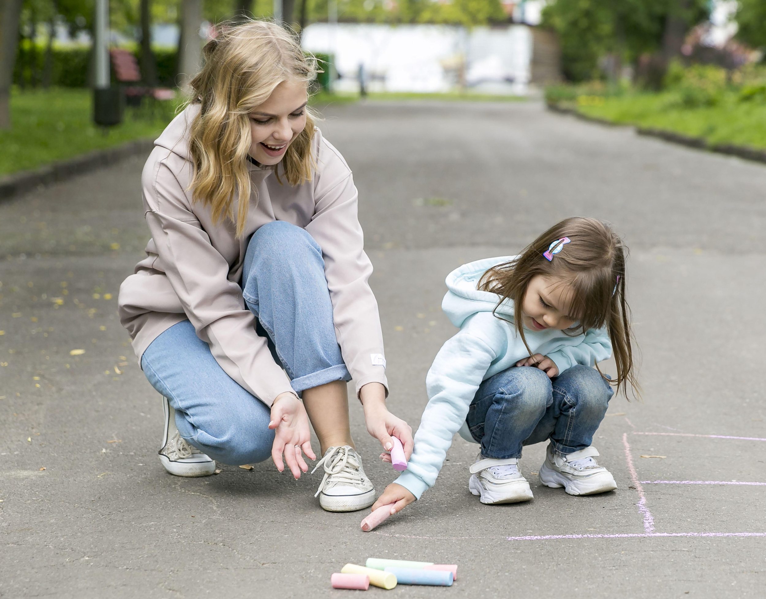 02 front-view-mother-child-playing-park.jpg