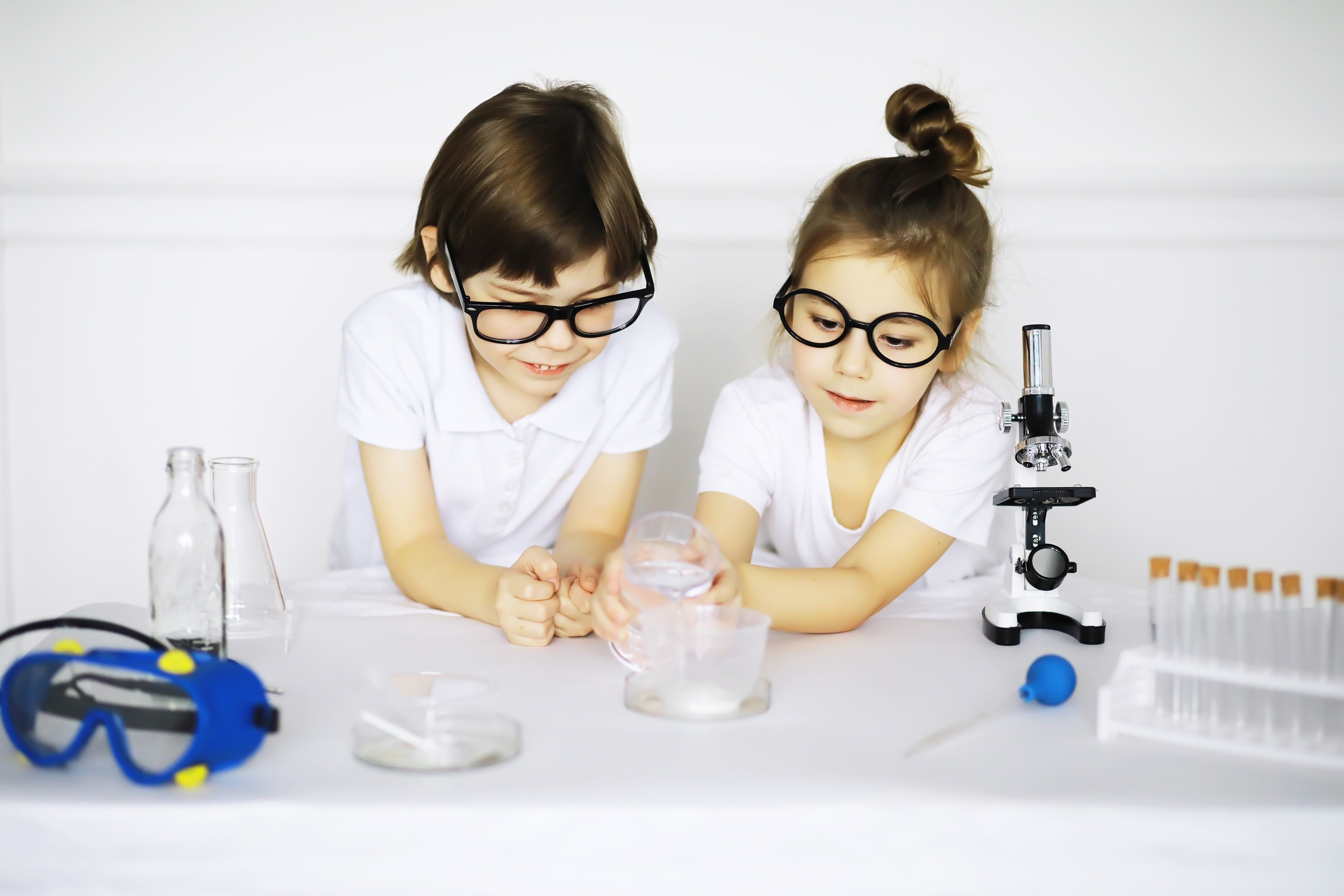 01 two-cute-children-chemistry-lesson-making-experiments-isolated-white-background.jpg