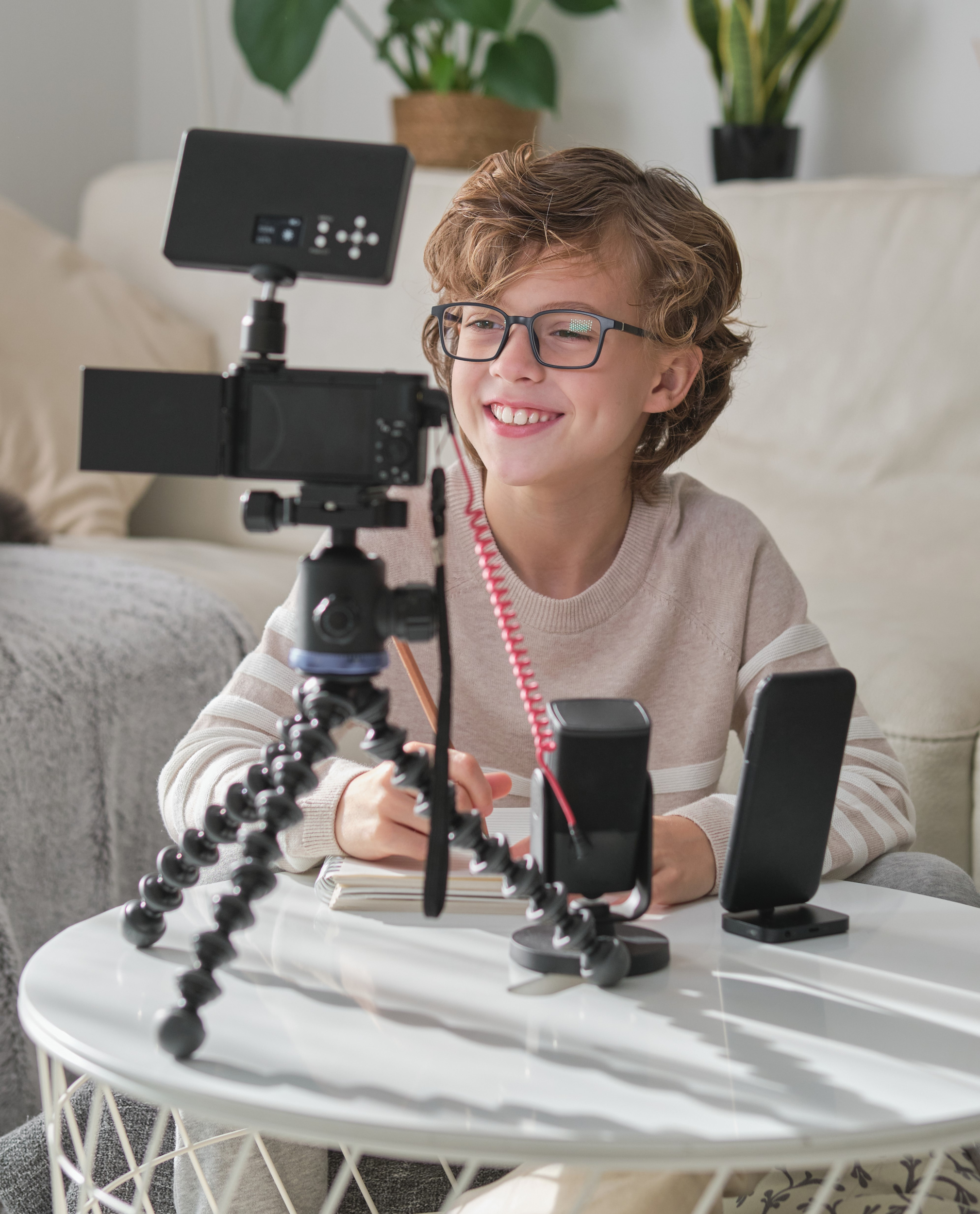 3 delighted-child-process-recording-video-online-blog-while-sitting-white-table-with-camera-tripod-microphone-home.jpg 3 delighted-child-process-recording-video-online-blog-while-sitting-white-table-with-camera-tripod-microphone-home.jpg